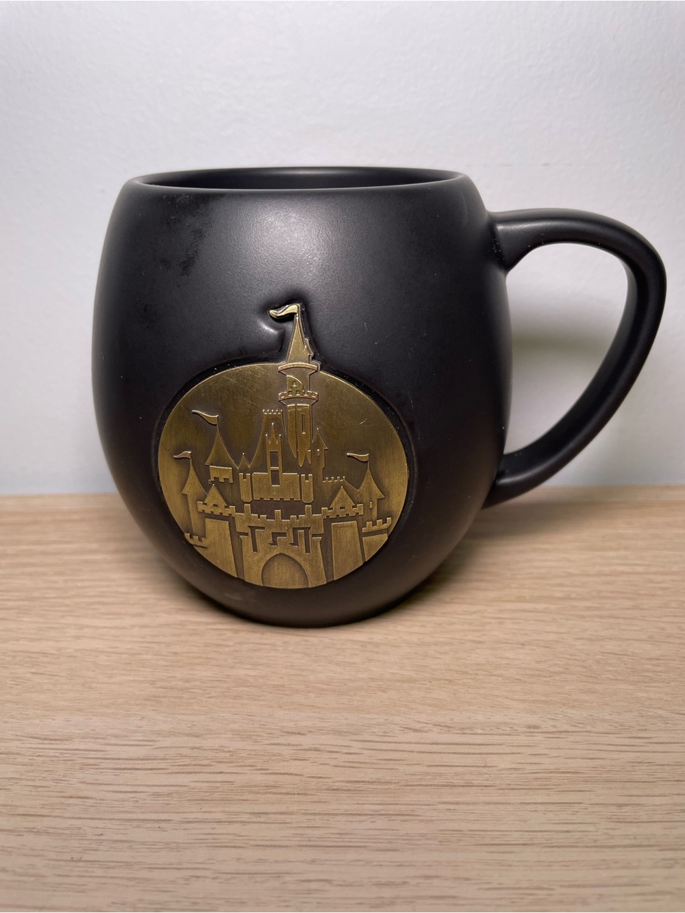 Disney Parks Sleeping Beauty Castle Black Matte Gold Medallion Coffee Mug